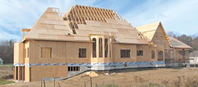 New House with Roof Trusses under Construction